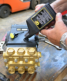 Adding GP Series 100 oil to a high-pressure pump